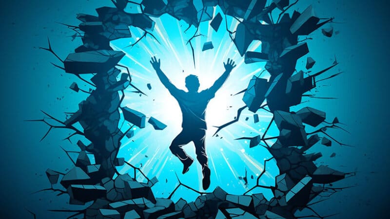 persoon die door een muur breekt