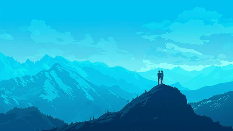 Een paar staat samen op een bergtop